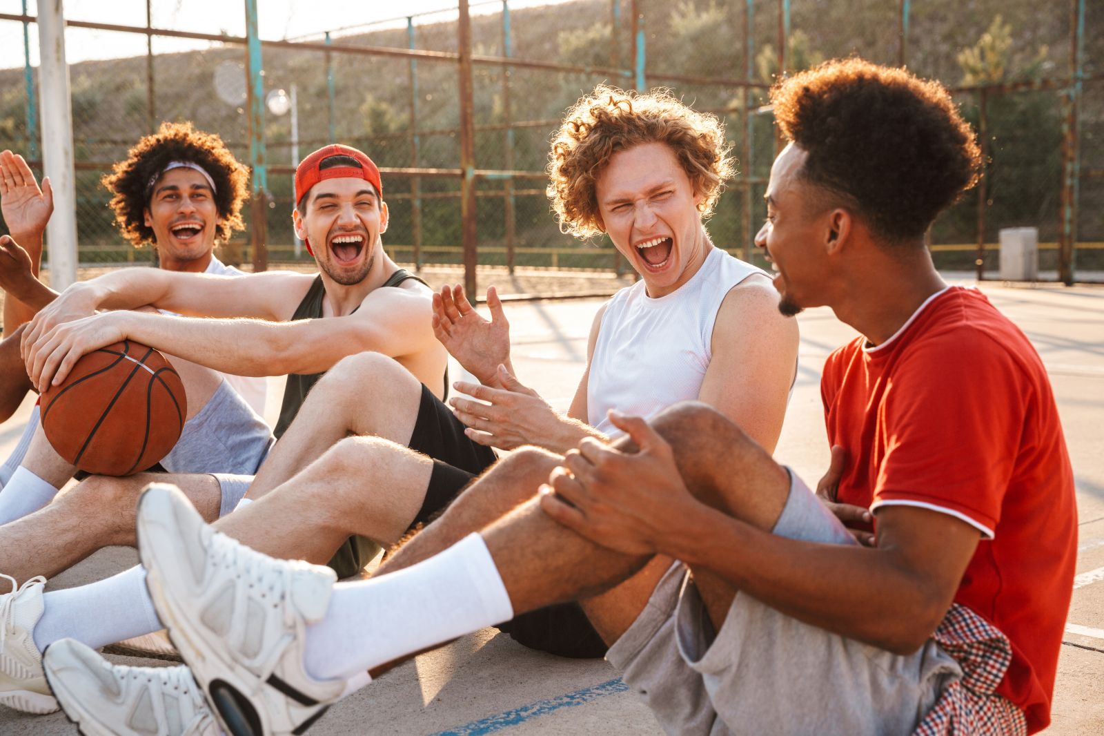 student laughing on the basketball court