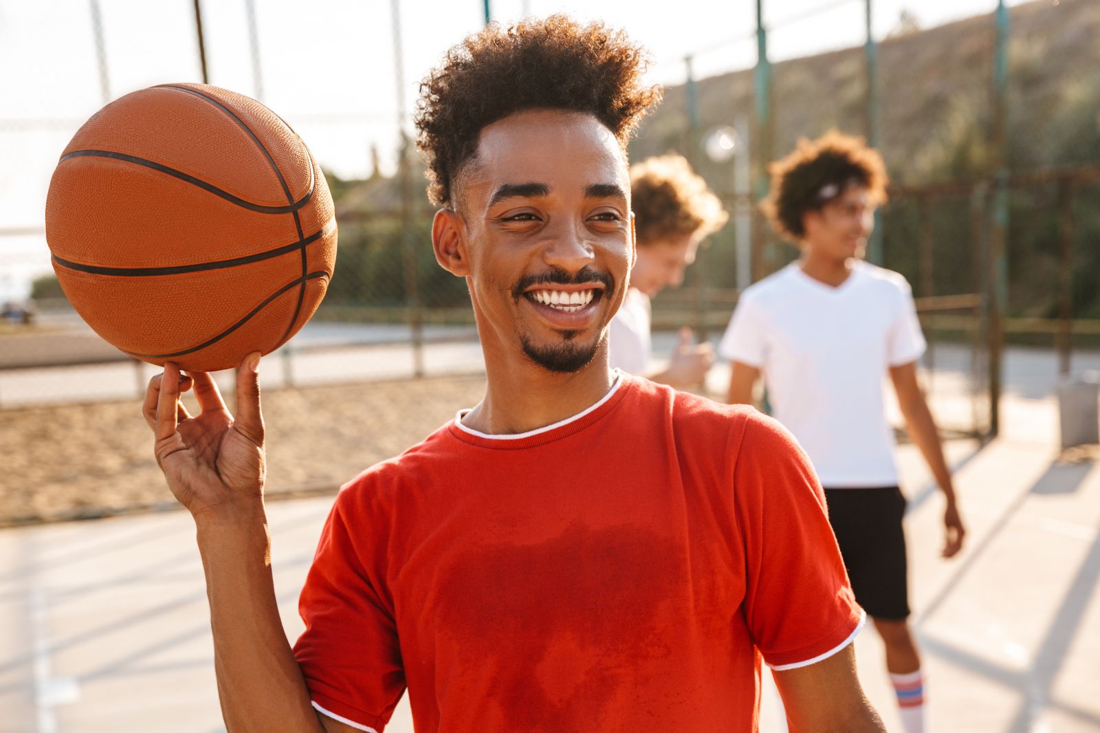 student with basketball